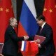 Russia's President Vladimir Putin, left, and China's President Xi Jinping shake hands after signing an agreement during a bilateral meeting at the Xijiao State Guesthouse ahead of the fourth Conference on Interaction and Confidence Building Measures in Asia (CICA) summit, in Shanghai, China Tuesday, May 20, 2014. (AP Photo/Carlos Barria, Pool)