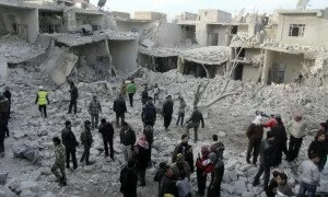 Residents search for survivors at a damaged site after what activists said was an air strike from forces loyal to Syria's President Bashar al-Assad in Tareek Al-Bab area of Aleppo, December 18, 2013. REUTERS/Saad Abobrahim (SYRIA - Tags: POLITICS CIVIL UNREST) - RTX16NKQ