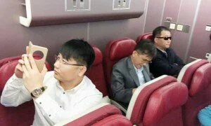 Passengers believed to be North Koreans including Kim Uk Il (L) are seen inside an airplane for the flight bound for Beijing, at an airport in Kuala Lumpur in Malaysia, in this photo taken by Kyodo March 30, 2017. Mandatory credit Kyodo/via REUTERS