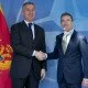 NATO Secretary General Anders Fogh Rasmussen welcomes the Prime Minister of Montenegro, Milo Dukanovic